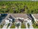 Aerial view of townhouses with garages at 1592 Wynford Cir, Tavares, FL 32778