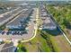 Aerial view of a row of townhomes in a community setting at 1592 Wynford Cir, Tavares, FL 32778