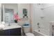 Bathroom with single vanity, tub, and shower at 1592 Wynford Cir, Tavares, FL 32778