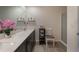 Double vanity bathroom with a large mirror and shower at 1592 Wynford Cir, Tavares, FL 32778
