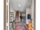 Bright and spacious entryway with staircase, decorative rug, and Gathering photos at 1592 Wynford Cir, Tavares, FL 32778