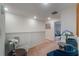 Upper hallway with seating area and elegant decor at 1592 Wynford Cir, Tavares, FL 32778