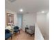 Upper hallway with seating area and elegant decor at 1592 Wynford Cir, Tavares, FL 32778