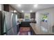 Modern kitchen with stainless steel appliances and granite countertops at 1592 Wynford Cir, Tavares, FL 32778
