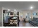 Open concept kitchen and dining area with modern finishes at 1592 Wynford Cir, Tavares, FL 32778