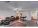 Spacious living room with hardwood floors, ceiling fan, and access to the entryway at 1592 Wynford Cir, Tavares, FL 32778