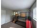 Bedroom with carpeted floors and a bunk bed with a slide at 1695 Lee Rd # B216, Winter Park, FL 32789