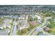 Aerial view of apartment community with pool, tennis courts, and parking at 2361 Silver Palm Dr, Kissimmee, FL 34747