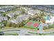 Aerial view of apartment community with tennis courts and pool at 2361 Silver Palm Dr, Kissimmee, FL 34747