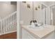 Bathroom with a sink and mirror near a staircase at 2361 Silver Palm Dr, Kissimmee, FL 34747