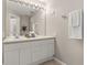 Bathroom with a double vanity and a large mirror at 2361 Silver Palm Dr, Kissimmee, FL 34747