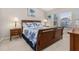 Primary bedroom with a queen bed, nightstands, and plenty of natural light at 2361 Silver Palm Dr, Kissimmee, FL 34747