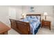 Bedroom with queen bed, nightstands, and large windows at 2361 Silver Palm Dr, Kissimmee, FL 34747