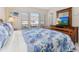 Primary bedroom with a queen bed and dresser at 2361 Silver Palm Dr, Kissimmee, FL 34747