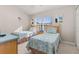 Bedroom with twin beds, nightstands, and plenty of natural light at 2361 Silver Palm Dr, Kissimmee, FL 34747