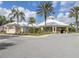Community center with a circular design and palm trees at 2361 Silver Palm Dr, Kissimmee, FL 34747