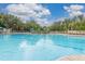Relaxing community pool with plenty of lounge chairs at 2361 Silver Palm Dr, Kissimmee, FL 34747