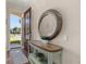 Bright entryway with a console table and a large circular mirror at 2361 Silver Palm Dr, Kissimmee, FL 34747