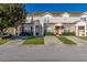 Two-story townhome with two-car driveway and landscaping at 2361 Silver Palm Dr, Kissimmee, FL 34747