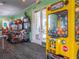 Game room with arcade games and a bouncy ball machine at 2361 Silver Palm Dr, Kissimmee, FL 34747