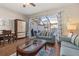 Living room with sofa, coffee table, and views of the dining and kitchen areas at 2361 Silver Palm Dr, Kissimmee, FL 34747