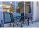Small patio with table and chairs at 2361 Silver Palm Dr, Kissimmee, FL 34747