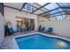 Private screened pool and patio area with seating at 2361 Silver Palm Dr, Kissimmee, FL 34747