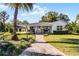 Modern house exterior with landscaped yard and walkway at 2810 Lake Howell Ln, Winter Park, FL 32792