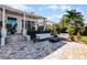 Relaxing patio with seating area and fire pit at 2810 Lake Howell Ln, Winter Park, FL 32792