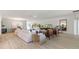 Spacious living room with light beige sofa and wood coffee tables at 309 Barebow Ln, Ormond Beach, FL 32174