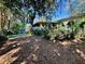 Large backyard with mature trees and privacy at 403 Tranquille Oaks Dr, Ocoee, FL 34761