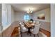 Bright dining room with wood flooring and elegant light fixture at 403 Tranquille Oaks Dr, Ocoee, FL 34761