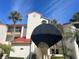 Exterior view of condo building with red tile roofs and covered entryway at 459 Hamptoncrest Cir # 307, Lake Mary, FL 32746