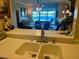 Kitchen sink with a view of the living room and water view at 459 Hamptoncrest Cir # 307, Lake Mary, FL 32746