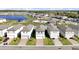 Aerial view of houses with community pool and playground at 4704 Homestead Trl, Saint Cloud, FL 34772