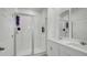 Bright bathroom with double vanity, shower, and large mirror at 4704 Homestead Trl, St Cloud, FL 34772