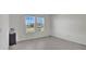 Bright bedroom with large windows and gray tile floors at 4704 Homestead Trl, St Cloud, FL 34772