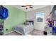 Charming bedroom with a twin bed and light green wall at 4704 Homestead Trl, St Cloud, FL 34772