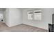 Simple bedroom with carpeted floor and two windows at 4704 Homestead Trl, St Cloud, FL 34772