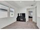 Spacious bonus room with large TV and carpet at 4704 Homestead Trl, St Cloud, FL 34772
