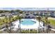 Resort-style community pool with lounge chairs and palm trees at 4704 Homestead Trl, St Cloud, FL 34772