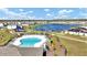 Aerial view of community pool, playground, and lake at 4704 Homestead Trl, St Cloud, FL 34772