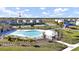 Community pool with lounge chairs and playground nearby at 4704 Homestead Trl, St Cloud, FL 34772