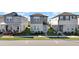 Three-story townhouses with front yards and parking at 4704 Homestead Trl, St Cloud, FL 34772