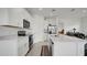 Modern kitchen with white cabinets and quartz countertops at 4704 Homestead Trl, St Cloud, FL 34772