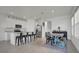 Open concept kitchen and dining area with white cabinets and stainless steel appliances at 4704 Homestead Trl, St Cloud, FL 34772