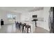 Open concept kitchen with white cabinets and a large kitchen island at 4704 Homestead Trl, St Cloud, FL 34772