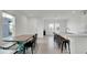 Open concept kitchen and dining area with island and farmhouse table at 4704 Homestead Trl, St Cloud, FL 34772