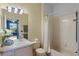 Bathroom with a shower/tub combo, vanity, and white tile at 7135 Yacht Basin Ave # 237, Orlando, FL 32835
