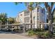 Three-story building with covered parking and balconies at 7135 Yacht Basin Ave # 237, Orlando, FL 32835
